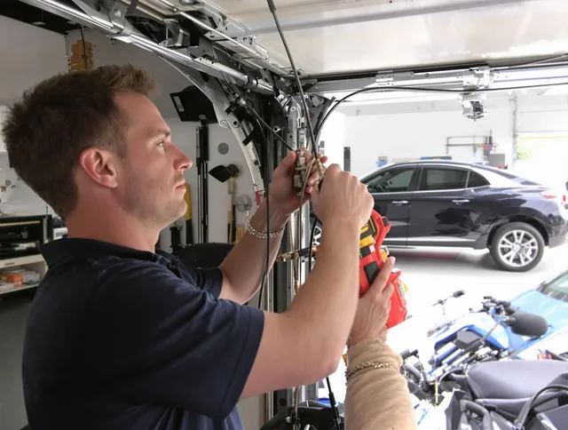 Lakewood Garage Door Repair safety certified technician performing cable replacement in Lakewood