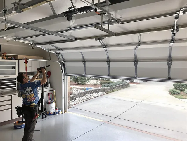 Garage door track repair service by Lakewood Garage Door Repair in Lakewood